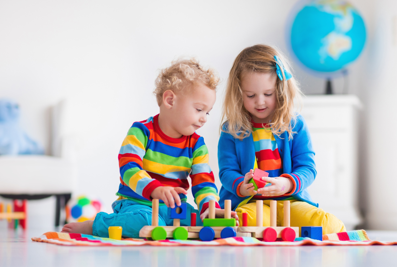 Children playing with wooden toys